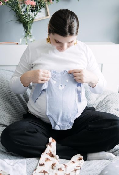 women fold baby cloth